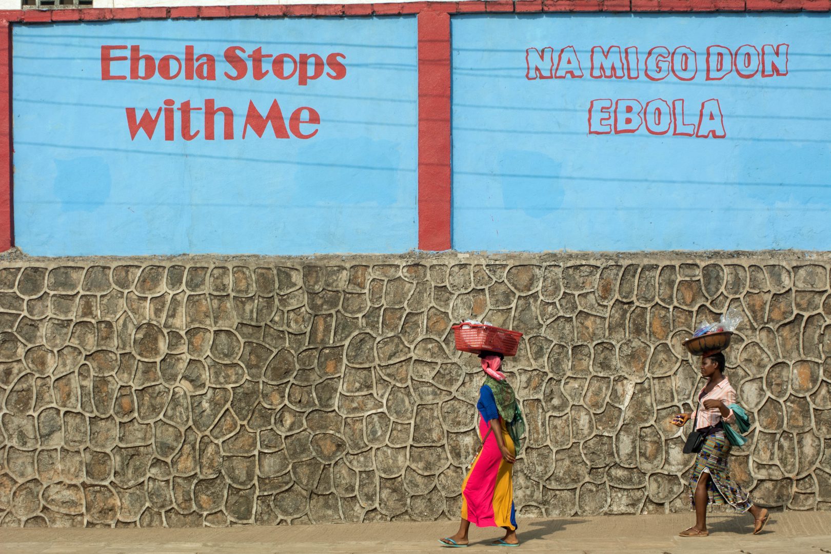 Woman carries basket on her head