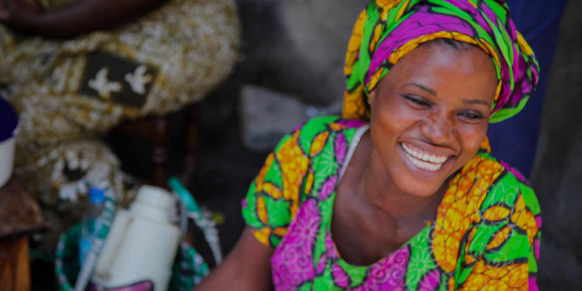 Brightly dressed women shows her smile