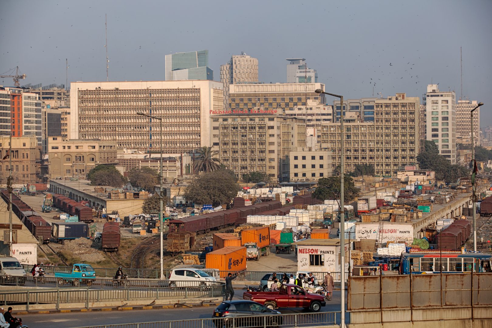 An elevated view shows the business and financial hub of Karachi, Pakistan